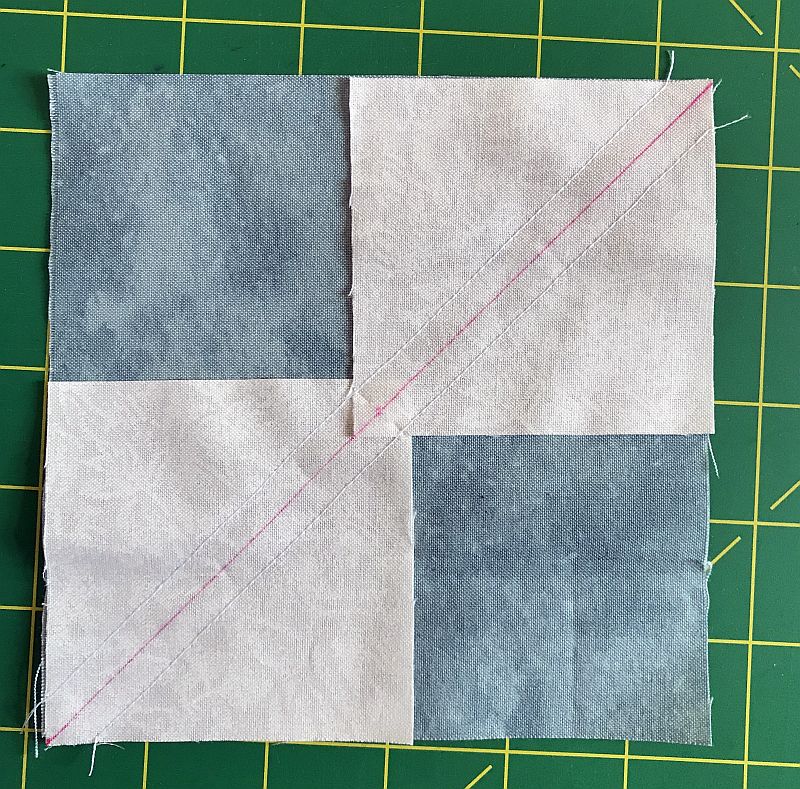 Picture showing the first step in making Flying Geese blocks using the Wing Clipper or No Math ruler.