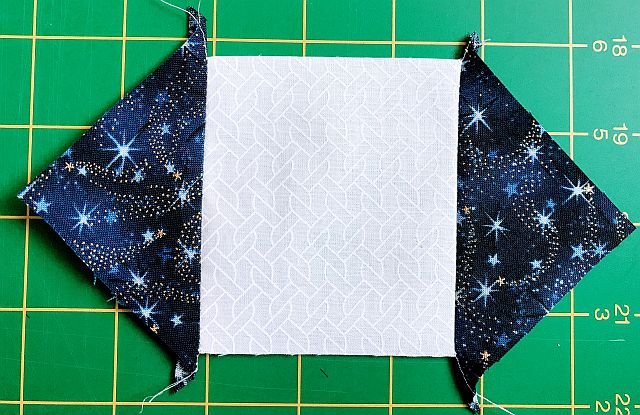 A square in a square quilt block being sewn