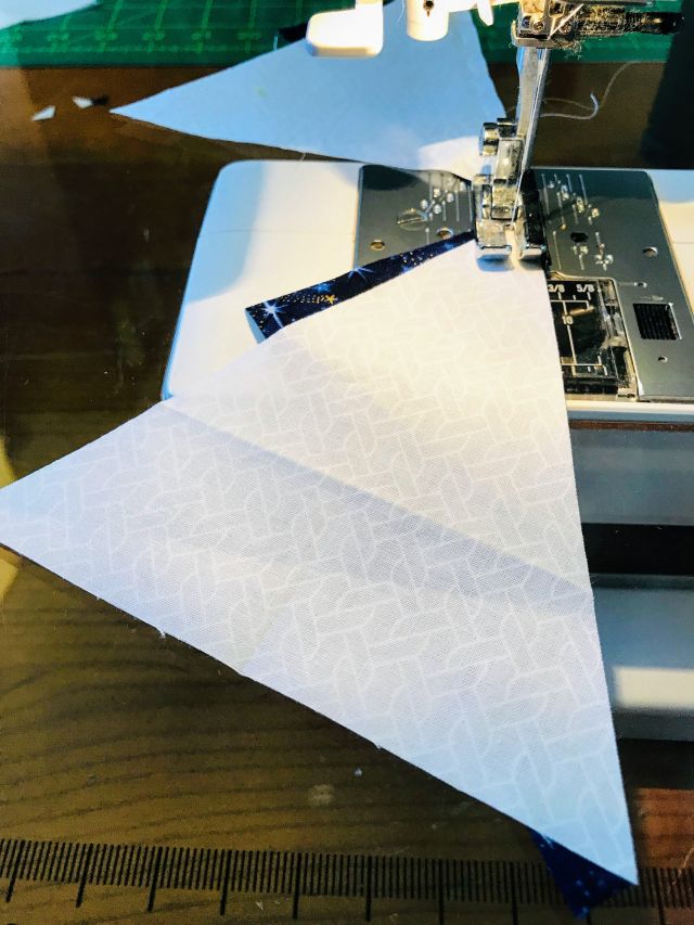 Quilt Pieces being sewn into a Triangle in a Square block