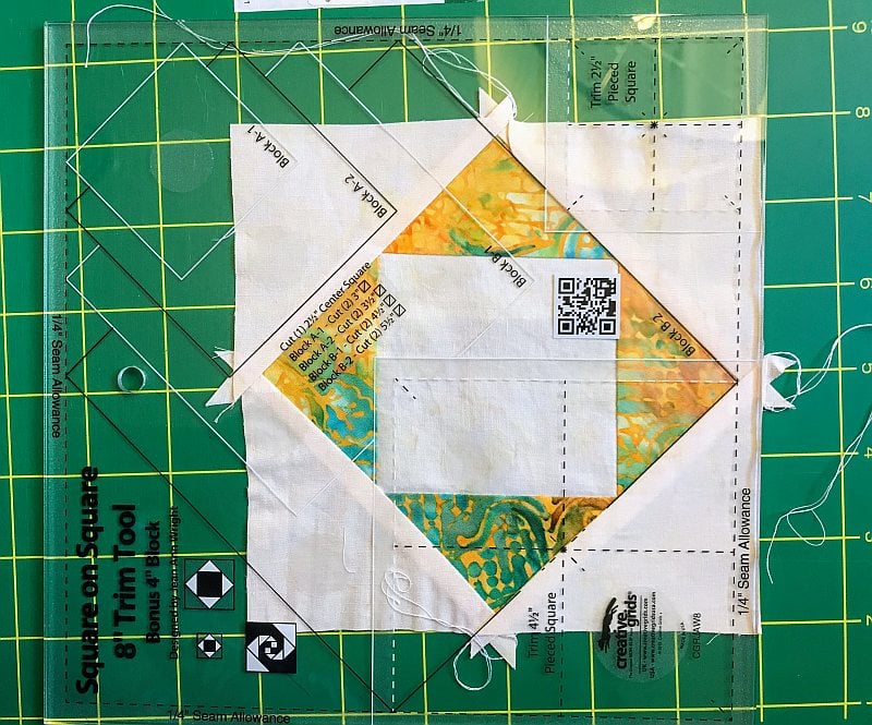 Squaring up a quilt block with a CGR ruler