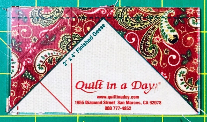 The Fourth Step in Making a Flying Goose Quilt Block using Squares