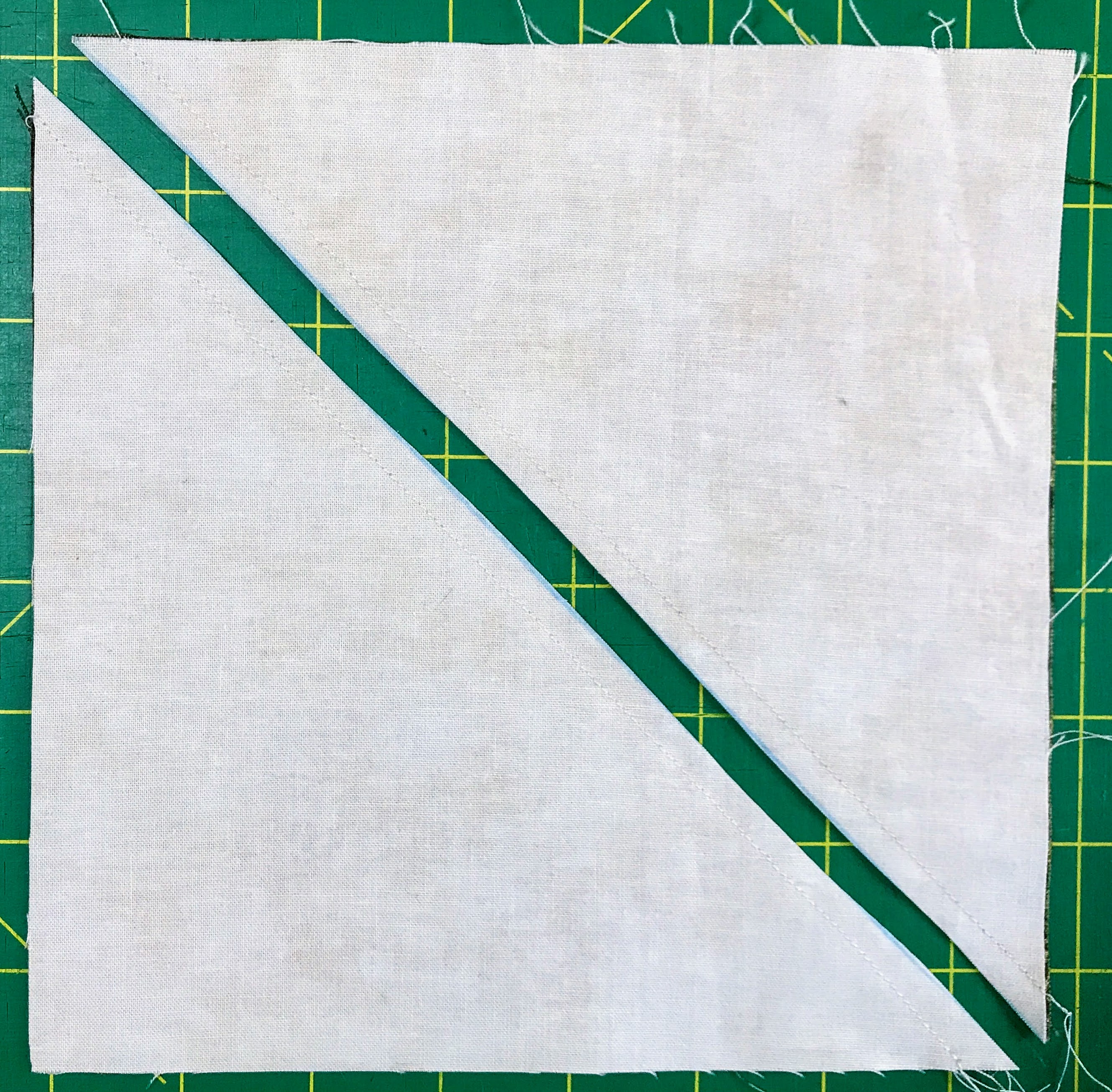 To make an HST, sew 1/4" on either side of a diagonal line and cut on the line