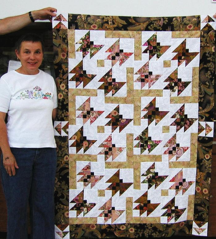 This mystery quilt features butterfly blocks made with oriental fabric