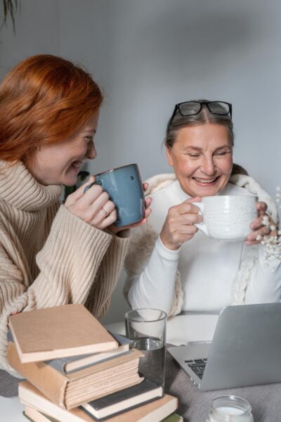 A heartwarming moment of a mother and daughter sharing coffee at home, radiating warmth and togetherness. From Cottonbro Studio
