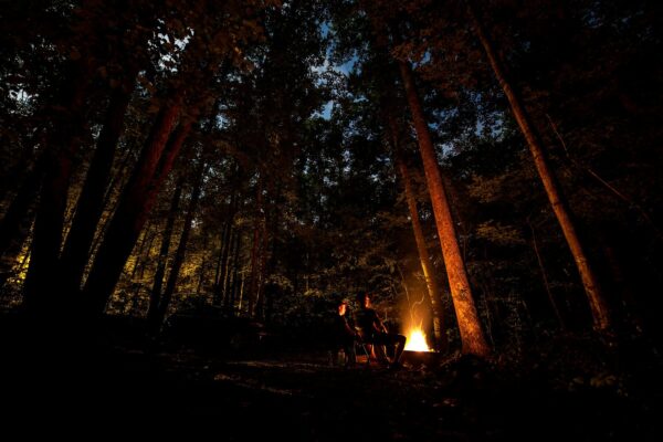 Serene night camping by a crackling fire amid the trees in Tapoco, NC. Photo by Kelly