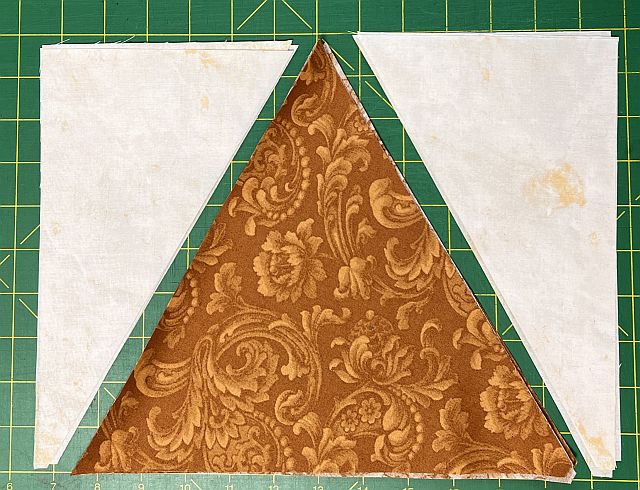 Stained glass quilt block, fabric patchwork, sewing project materials, patchwork fabric for quilting, Scrapdash quilt supplies, craft fabric for quilting, decorative fabric piece for quilt, textile patchwork for sewing, quilting fabric art, sewing and quilting materials.