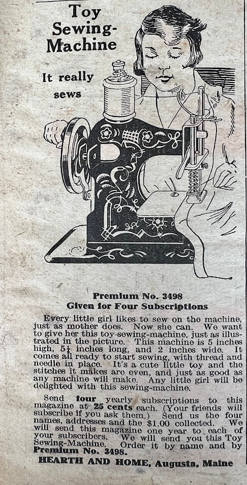 Vintage newspaper ad showing a girl using a toy sewing machine. The ad describes the machine’s features, offers it as a subscription premium, and highlights its appeal to children. Text and illustration dominate the image.